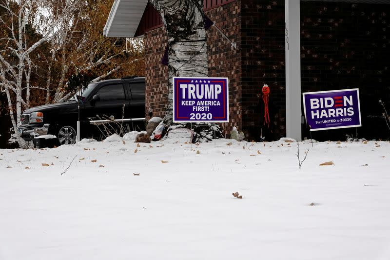 Trump and Biden signs in same Fargo yard