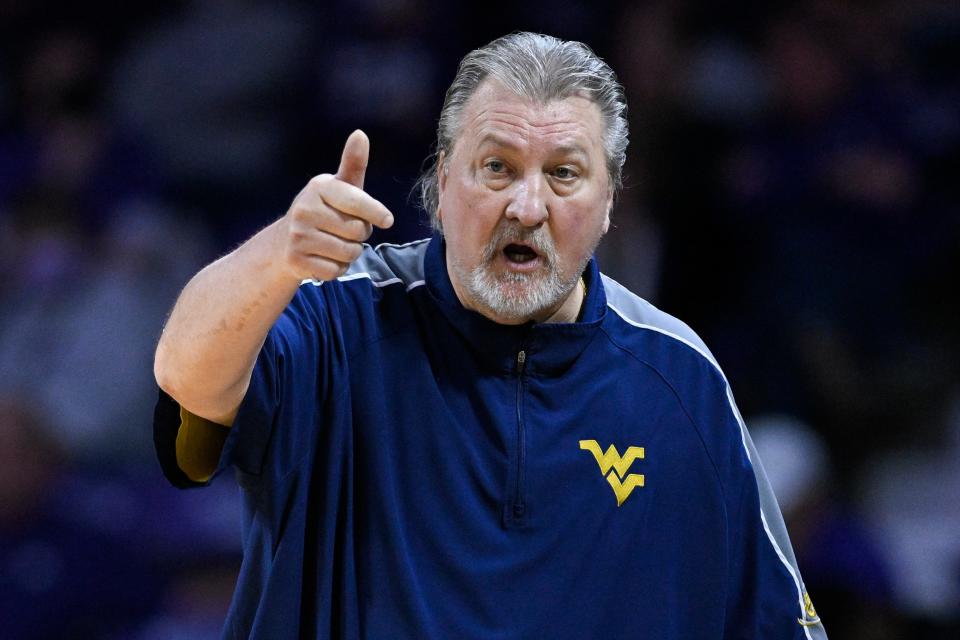 West Virginia coach Bob Huggins shouts to players during the second half of the team's NCAA college basketball game against Kansas State in Manhattan, Kan., Monday, Feb. 14, 2022. (AP Photo/Reed Hoffmann)