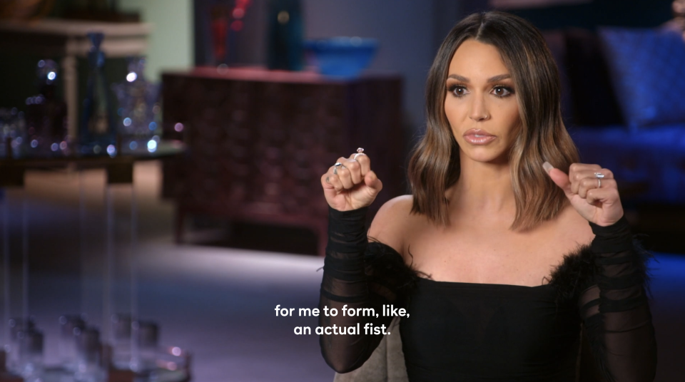 Scheana trying to form a fist