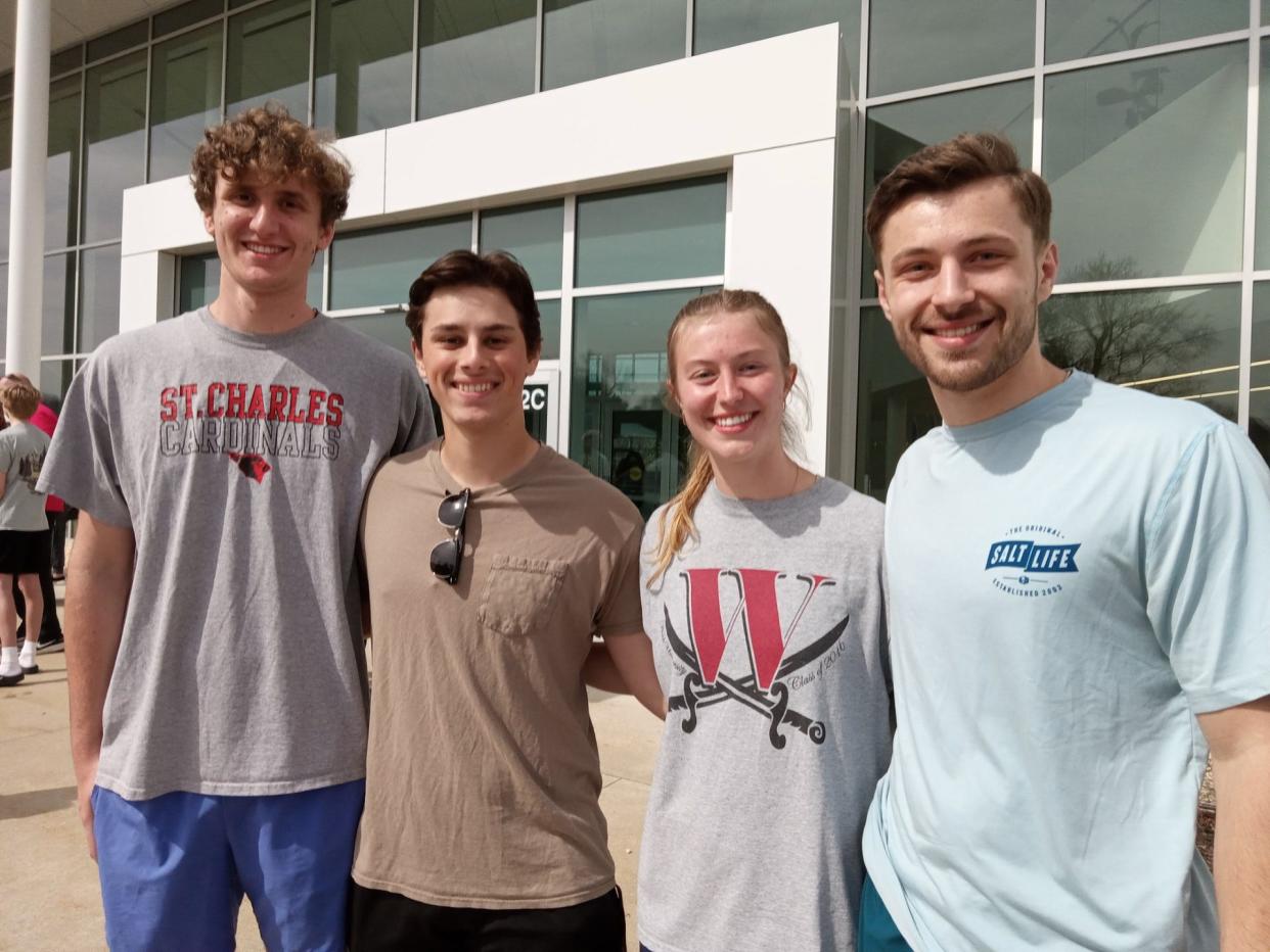 Friends who gathered Monday to watch the eclipse at Walsh University in North Canton included, left to right, Matthew Voegele, Mathew Bagatta, Lauren Michele and Evan Stertz.