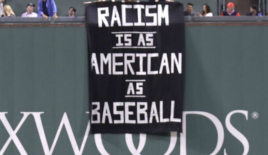 'Racism Is As American As Baseball' Sign At Fenway Park Over Green Monster