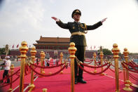 A military band rehearses for a ceremony to mark the 100th anniversary of the founding of the ruling Chinese Communist Party at Tiananmen Gate in Beijing Thursday, July 1, 2021. (AP Photo/Ng Han Guan)