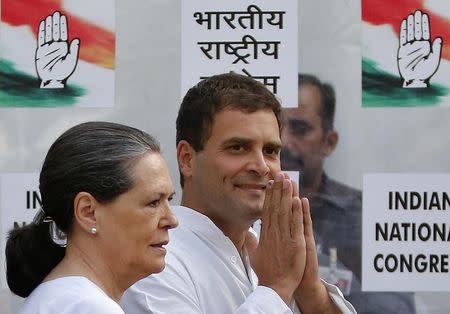 Congress party chief Sonia Gandhi (L) and her son and vice-president of Congress Rahul Gandhi arrive to address a news conference in New Delhi May 16, 2014. REUTERS/Anindito Mukherjee