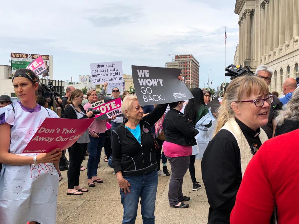 Protesters gather in downtown Louisville, Ky., for a rally against anti-abortion bills May 21.