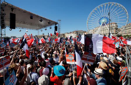 Supporters of Jean-Luc Melenchon of the French far left Parti de Gauche and candidate for the 2017 French presidential election hold French flags during a political rally in Marseille, France, April 9, 2017. REUTERS/Jean-Paul Pelissier