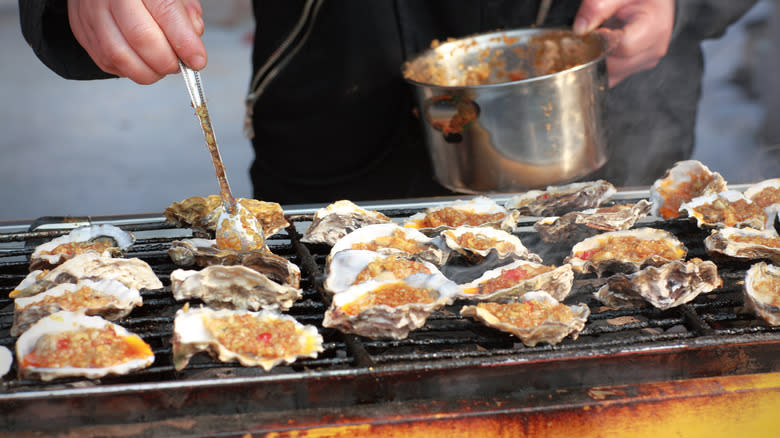 Oysters being grilled 