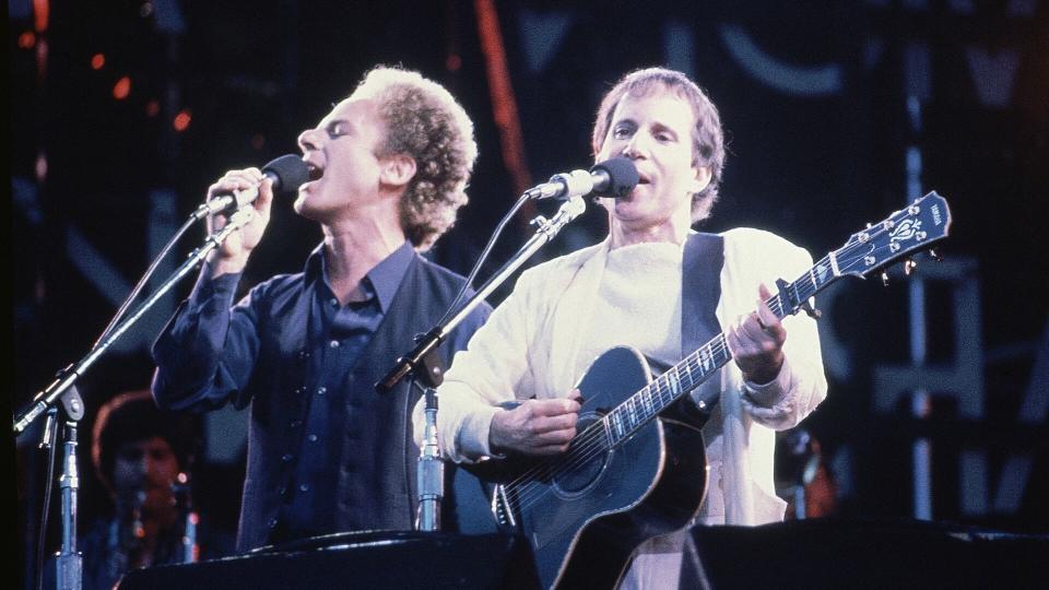 Mandatory Credit: Photo by John Glanville/AP/Shutterstock (7359300a)American pop duo Art Garfunkel, left, and Paul Simon serenade an audience during a concert in London, England in June 1982London Simon Garfunkel, London, United Kingdom England.