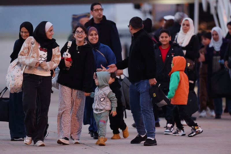 Spanish-Palestinians and Palestinians evacuated from Gaza arrive at a military base outside Madrid