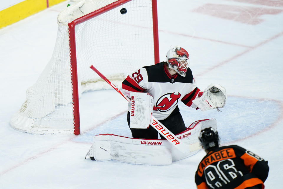 New Jersey Devils' Mackenzie Blackwood, left, cannot stop a goal by Philadelphia Flyers' Joel Farabee during the third period of an NHL hockey game, Saturday, May 1, 2021, in Philadelphia. (AP Photo/Matt Slocum)