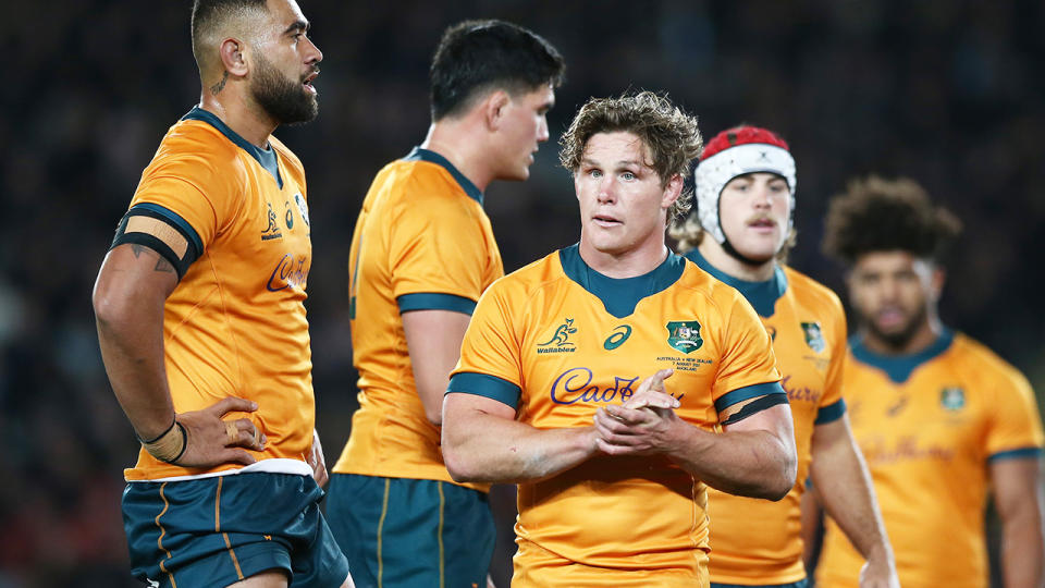 Wallabies captain Michael Hooper walks off the field after the loss to the All-Blacks.