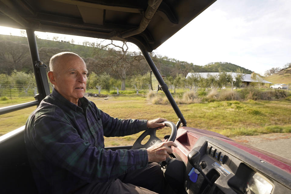 FILE - Former California Gov. Jerry Brown uses an all-terrain vehicle to tour his Colusa County ranch near Williams, Calif., Wednesday, March 2, 2022. Brown is living off the grid in retirement on a rural stretch of land his family has owned since the 19th century. A beetle, seen for the first time in 55 years, will be named after Brown after a scientist from the University of California, Berkeley, found it on Brown's property. The beetle will be named the Bembidion brownorum. (AP Photo/Rich Pedroncelli, File)