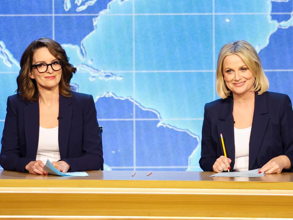 Tina Fey and Amy Poehler speaking at the 2024 Emmy Awards.