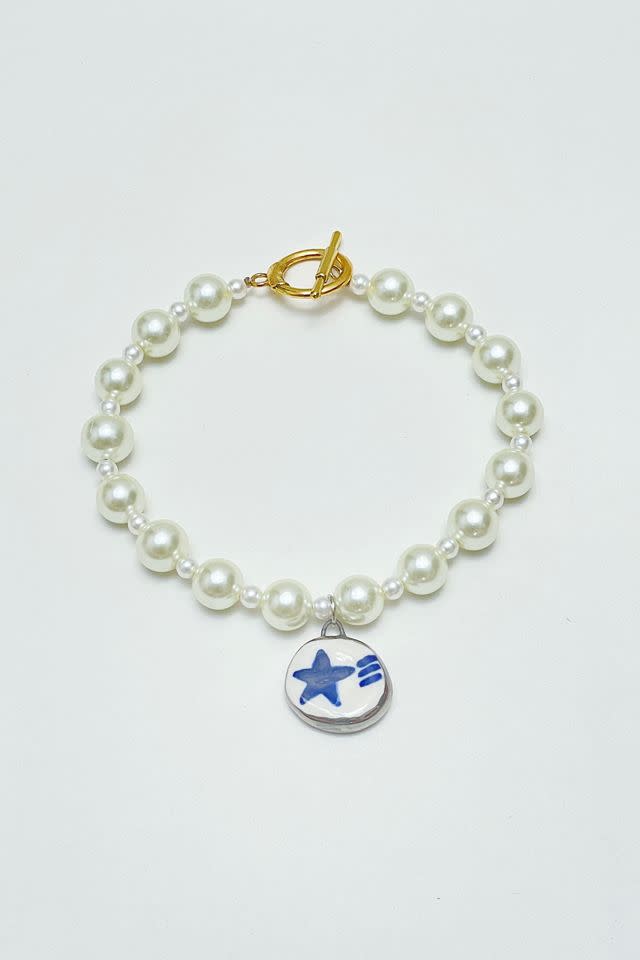 <p><a href="https://go.redirectingat.com?id=74968X1596630&url=https%3A%2F%2Fwww.urbanoutfitters.com%2Fshop%2Fblooberry-navy-star-necklace&sref=https%3A%2F%2Fwww.seventeen.com%2Flife%2Ffriends-family%2Fg41870934%2Fhanukkah-gifts-for-teens%2F" rel="nofollow noopener" target="_blank" data-ylk="slk:Shop Now;elm:context_link;itc:0;sec:content-canvas" class="link rapid-noclick-resp">Shop Now</a></p><p>Navy Star Necklace</p><p>urbanoutfitters.com</p><p>$70.00</p>