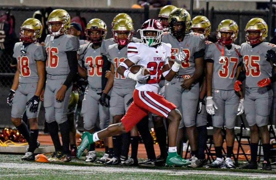 Warner Robins’ Myles Joyner (28) runs toward the end zone for a touchdown after intercepting a pass during the Demons’ 31-28 overtime win at Creekside Friday night.