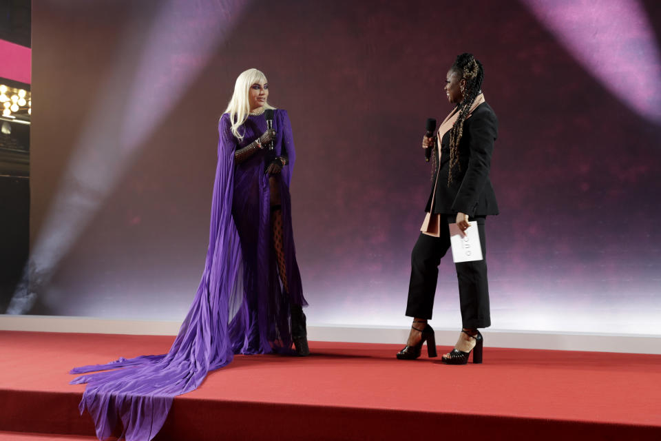 Lady Gaga stunned fans with her purple split dress. (ohn Phillips/Getty Images for Metro-Goldwyn-Mayer Studios and Universal Pictures)