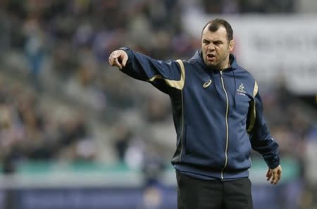 Australian Wallabies head coach Michael Cheika directs his players during the warm-up before the rugby union test match against France at the Stade de France in Saint-Denis near Paris, November 15, 2014. REUTERS/Gonzalo Fuentes