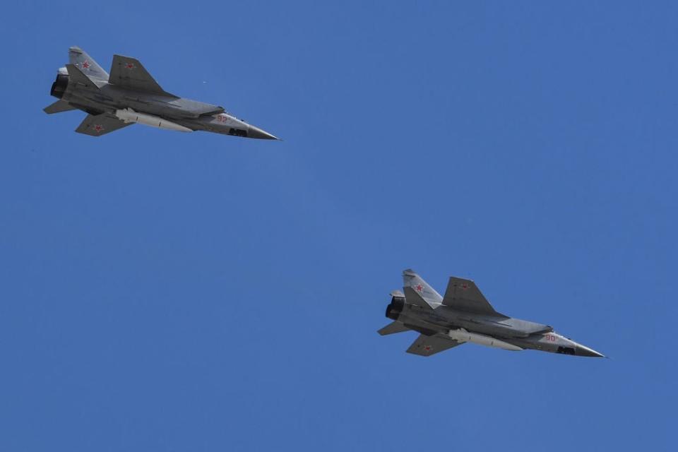 Russian MiG-31 supersonic interceptor jets carrying hypersonic Kinzhal missiles.