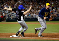 <p>Rep. Jared Polis (D-CO) trips over first base as Rep. Tom Rooney (R-FL) chases the ball during the annual Congressional Baseball Game at Nationals Park in Washington, June 15, 2017. (Photo: Joshua Roberts/Reuters) </p>