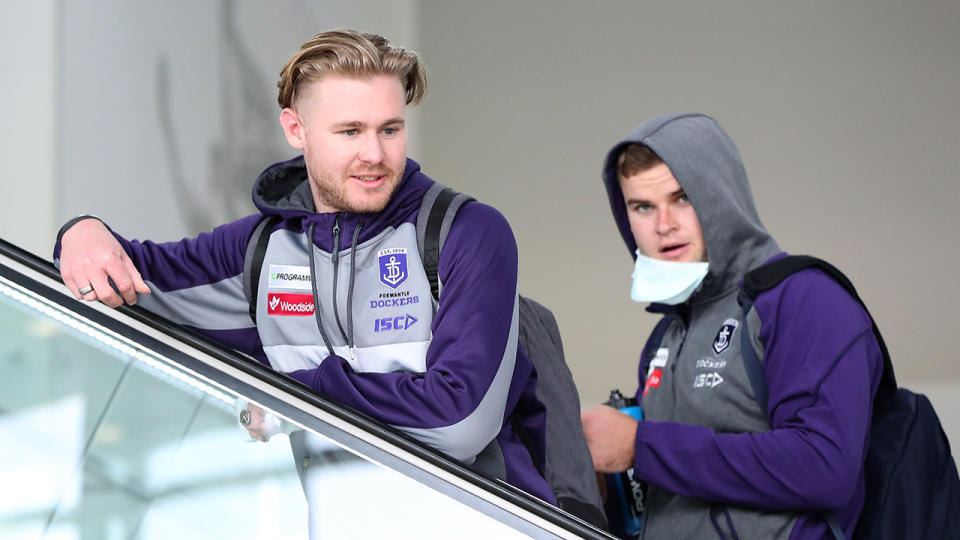 Seen here, Cam McCarthy with a Fremantle teammate at the airport.