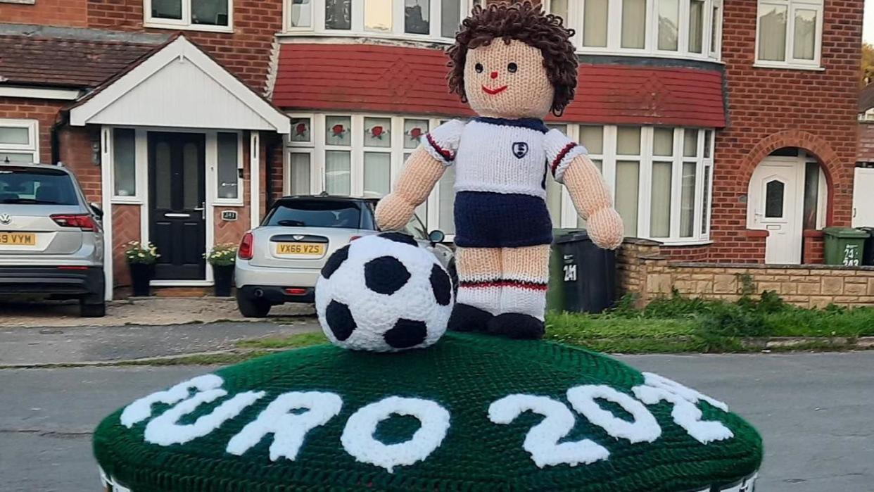 The postbox topper featuring a footballer and football on a green layout with Euro 2024 lettering