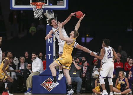 Apr 2, 2019; New York, NY, USA; Lipscomb Bisons forward Eli Pepper (22) blocks the shot of Wichita State Shockers center Asbjorn Midtgaard (33) in the first half of the NIT semifinals at Madison Square Garden. Mandatory Credit: Wendell Cruz-USA TODAY Sports