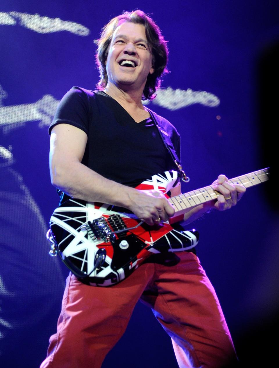 Eddie Van Halen playing guitar in 2012.