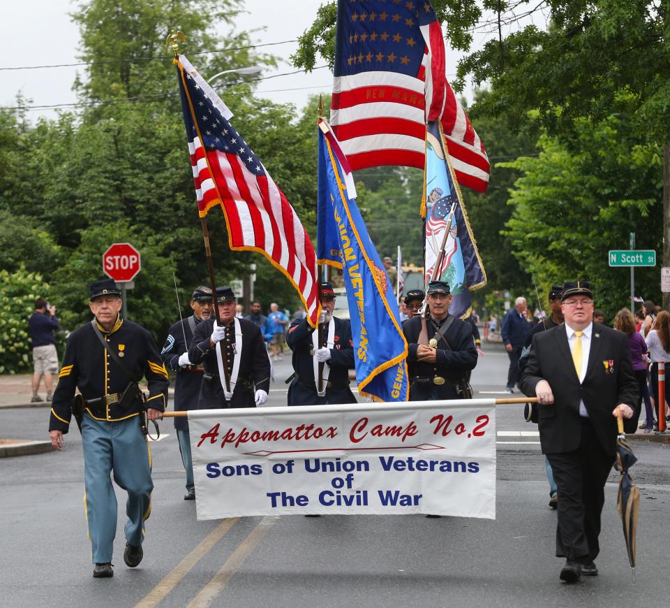 Marchers participate during the Wilmington Memorial Day parade along Delaware Avenue in 2019.