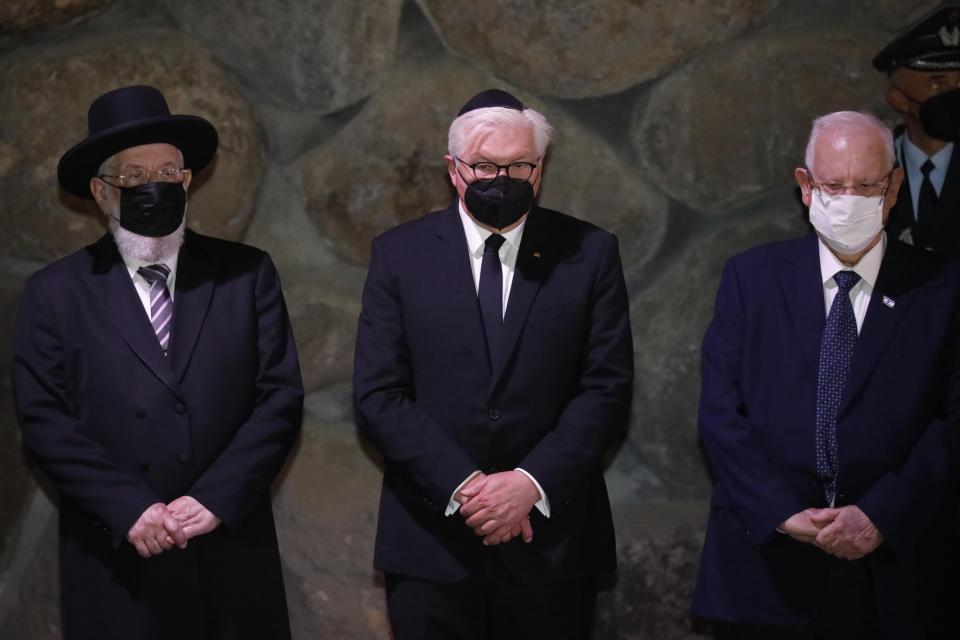 German President Frank-Walter Steinmeier, center, stands with Israel's President Reuven Rivlin, right, and Rabbi Yisrael Meir Lau during a visit to the Hall of Remembrance at the Yad Vashem Holocaust memorial in Jerusalem, Thursday, July 1, 2021. (AP Photo/Ariel Schalit)