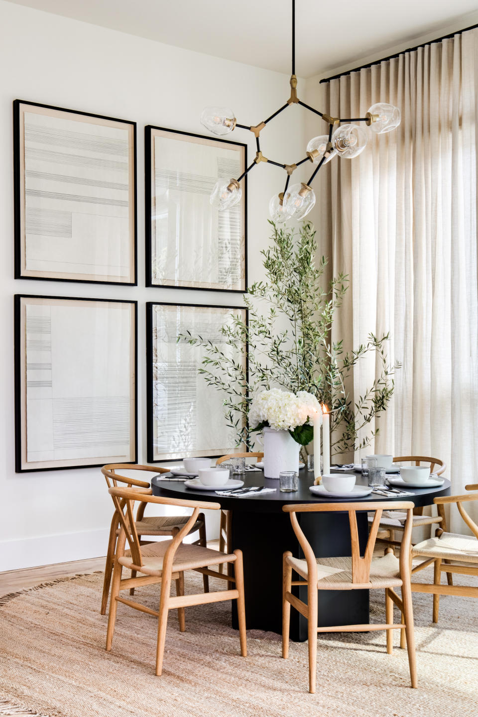 <p> If you are looking for apartment dining room ideas, know that your table's shape can have a big impact.  </p> <p> 'As apartments can be on the smaller side, your furniture shape can play a big part in how your space flows; for example, a round dining table is going to be a lot friendlier and more space-efficient than a square or rectangular one.  </p> <p> 'This Lindye Galloway designed dining room shows how to make it work successfully – the table and the curvy chairs sat on a circular coir rug give a much softer feel. The glass pendant follows that trend too,' says Lucy Searle, global editor in chief, <em>Homes & Gardens.</em> </p>