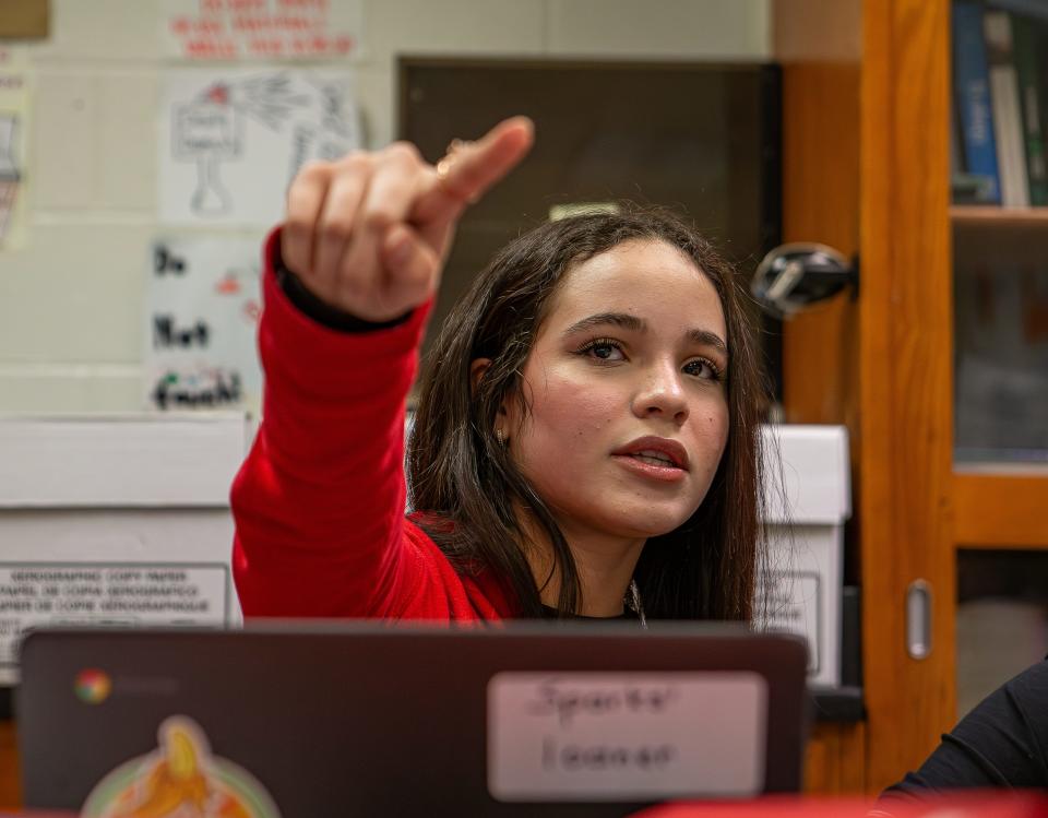 Seneca Junior Emily Camps pointed to a lesson on a TV screen while helping other ESL students during a recent biology class. Camps, who is originally from Cuba, says it took her a year to learn the English language with the help of the Duolingo app on her phone, and now she helps other students in her class by translating instructions and lessons in real time. March 8, 2024