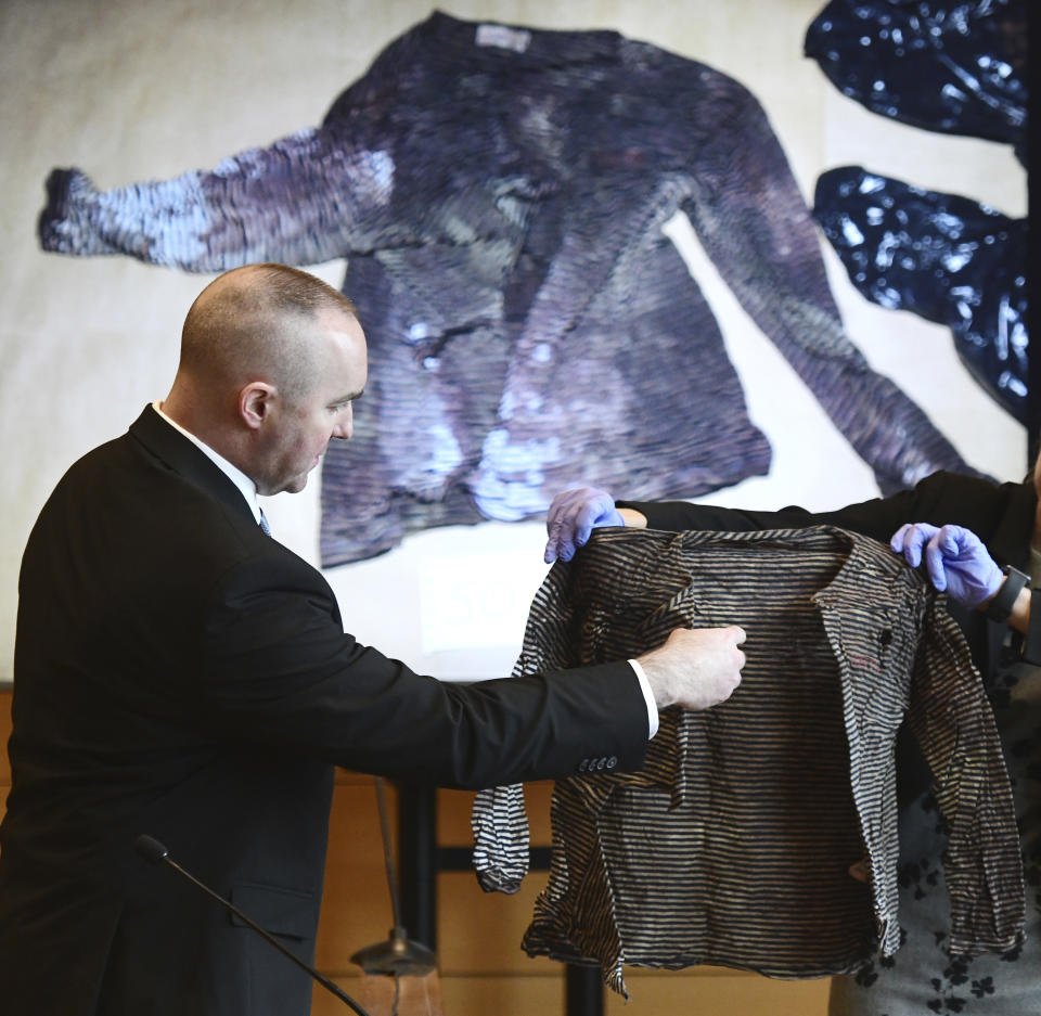 Connecticut State Police Sgt. Kevin Duggan points to a blood-like stain on a women's long-sleeve shirt seized from a trash can on Albany Avenue in Hartford as he testifies on day eight of Michelle Troconis' criminal trial at Connecticut Superior Court in Stamford, Conn. Tuesday, Jan. 23, 2024. Troconis is on trial for charges related to the disappearance and death of New Canaan resident Jennifer Dulos. (Tyler Sizemore/Hearst Connecticut Media via AP)