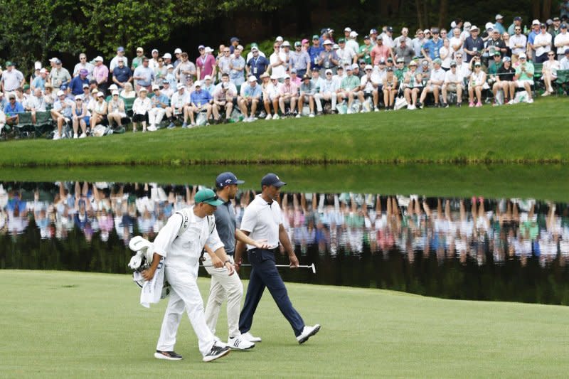 Tiger Woods (R) withdrew from the Masters Tournament in April because of an ankle injury. File Photo by John Angelillo/UPI