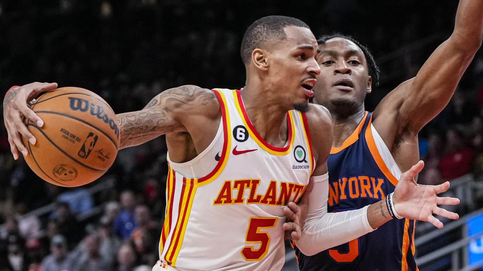 Feb 15, 2023; Atlanta, Georgia, USA; Atlanta Hawks guard Dejounte Murray (5) drives the lane defended by New York Knicks guard Immanuel Quickley (5) during the second half at State Farm Arena. Mandatory Credit: Dale Zanine-USA TODAY Sports