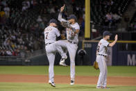 Detroit Tigers' Jordy Mercer (7) and Victor Reyes (22) celebrate their win over the Chicago White Sox in the second game of a baseball doubleheader, Saturday, Sept. 28, 2019, in Chicago. (AP Photo/Mark Black)