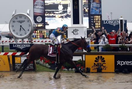 May 16, 2015; Baltimore, MD, USA; Victor Espinoza aboard American Pharoah wins the 140th Preakness Stakes at Pimlico Race Course. Mandatory Credit: Peter Casey-USA TODAY