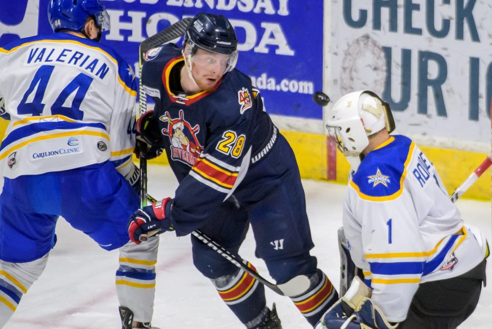 Peoria's Austin Wisely watches the puck fly by Roanoke goalie Austyn Roudebush's head in the second period of Game 2 of the SPHL finals Friday, April 29, 2022 at Carver Arena in Peoria.