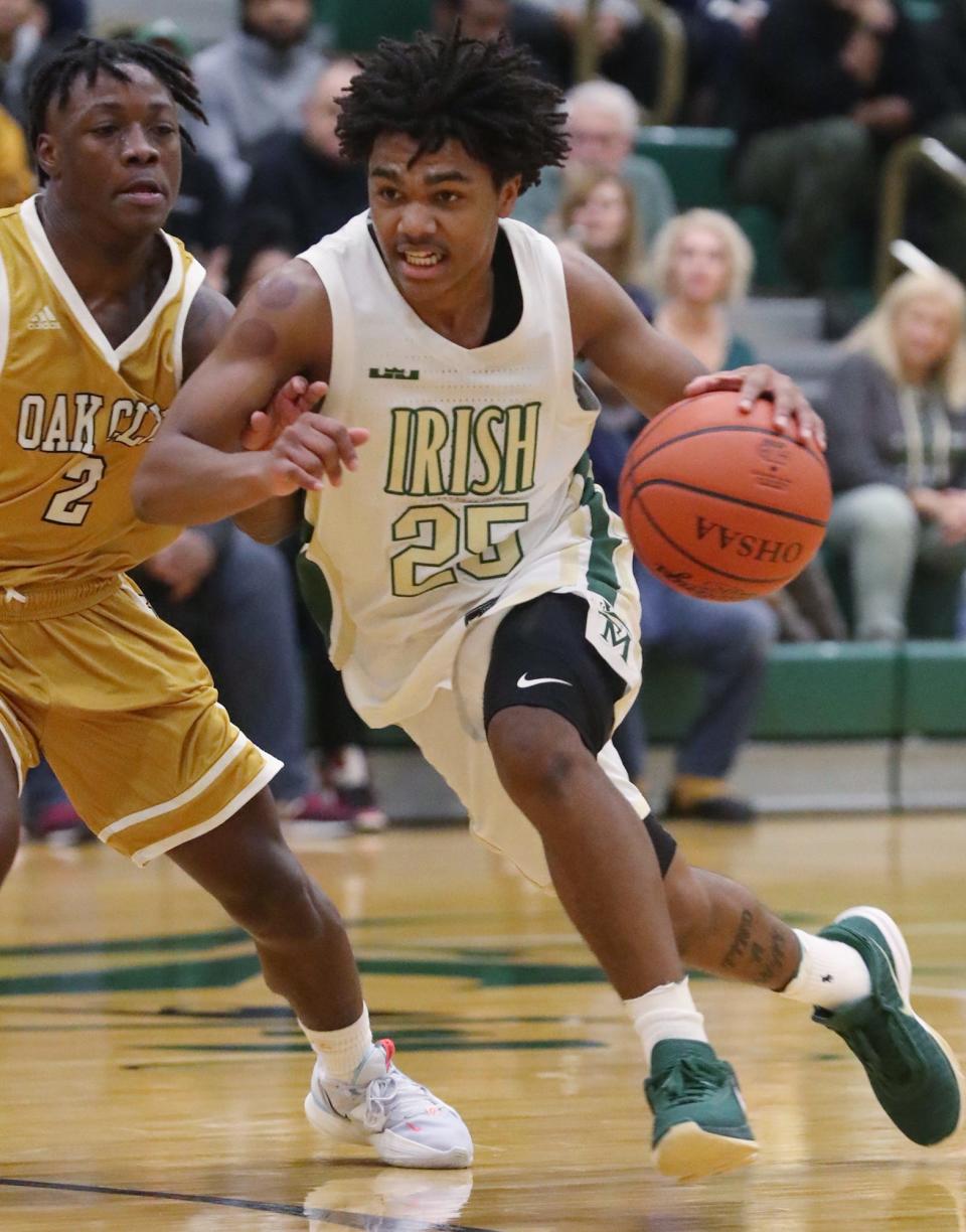 St. Vincent-St. Mary's Kevin Hamilton drives on  South Oak Cliff's Jayden Miller during their game at STVM last Wednesday.