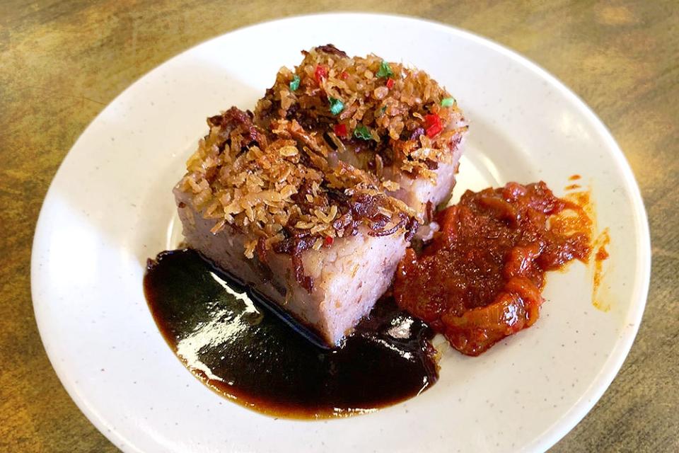 Yam cake ('wutáu gōu' in Cantonese), served with homemade 'sambal' and molasses-dark 'tim cheong' on the side.