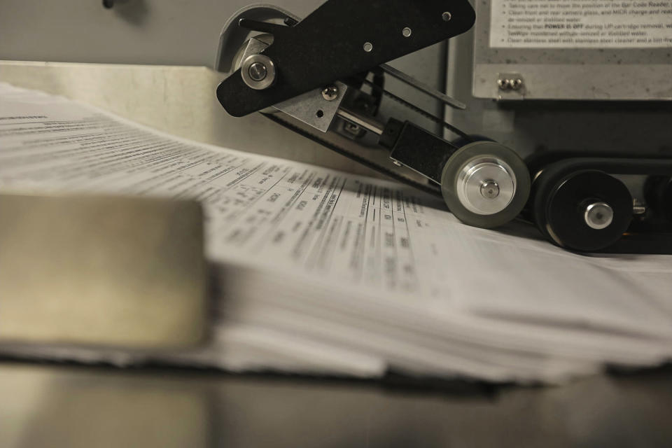 Part of the center’s record keeping process entails scanning documents from gun shops or wholesalers that are no longer in business. (Peter Kavanagh / NBC News)