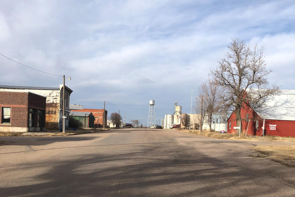 This photo provided by Carolyn Plotts shows Norcatur, Kan., on Nov. 18, 2020. It's barely a town battered by time on the windswept prairie of northwest Kansas. Not much left in Norcatur except for a service station, a grain elevator, a little museum, and a weekend hangout where the locals play pool, eat pizza and drink beer. But for the 150 or so people who still call this rural hamlet home the cancellation this year of the town's beloved Norcatur Christmas Drawing has shone a spotlight on a global coronavirus pandemic that has reached deep into rural America. (Carolyn Plotts via AP)