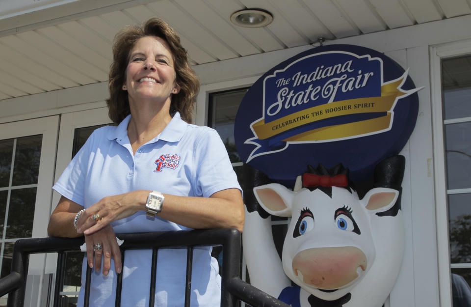 Indiana State Fair Executive Director Cindy Hoye pauses as she looks over the installation of a display at the Indiana State Fair Grounds in Indianapolis, Wednesday, July 25, 2012. Hoye is at the center of a deadly stage collapse last year says she is haunted by the tragedy but determined to help the fair move forward as it prepares for its Aug. 3 opening. (AP Photo/Michael Conroy)