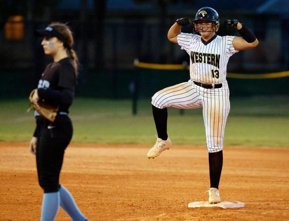 Western Wildcats catcher Jade Castillo (13) reacts after hitting a double during the game against Coral Springs Charter during the BCAA Big 8 softball championship game at Pompano Beach Community Park in Pompano Beach on Thursday, April 27, 2023.