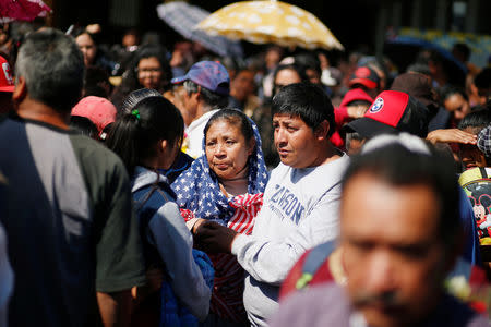 Residents react after a mass for their relatives who died during the explosion of a fuel pipeline ruptured by suspected oil thieves, in the municipality of Tlahuelilpan, state of Hidalgo, Mexico January 22, 2019. Picture taken January 22, 2019. REUTERS/Mohammed Salem