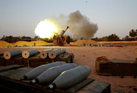 Libyan forces allied with the U.N.-backed government fire artillery towards IS fighters positions in Sirte. REUTERS/Goran Tomasevic