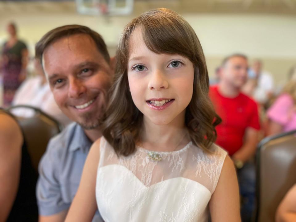 Little Miss contestant Annabelle Richmond relaxes with dad Johnny Richmond after she walked the red carpet at the Fairest of the Fair Pageant held at Beaver Ridge United Methodist Church Saturday, July 9, 2022.
