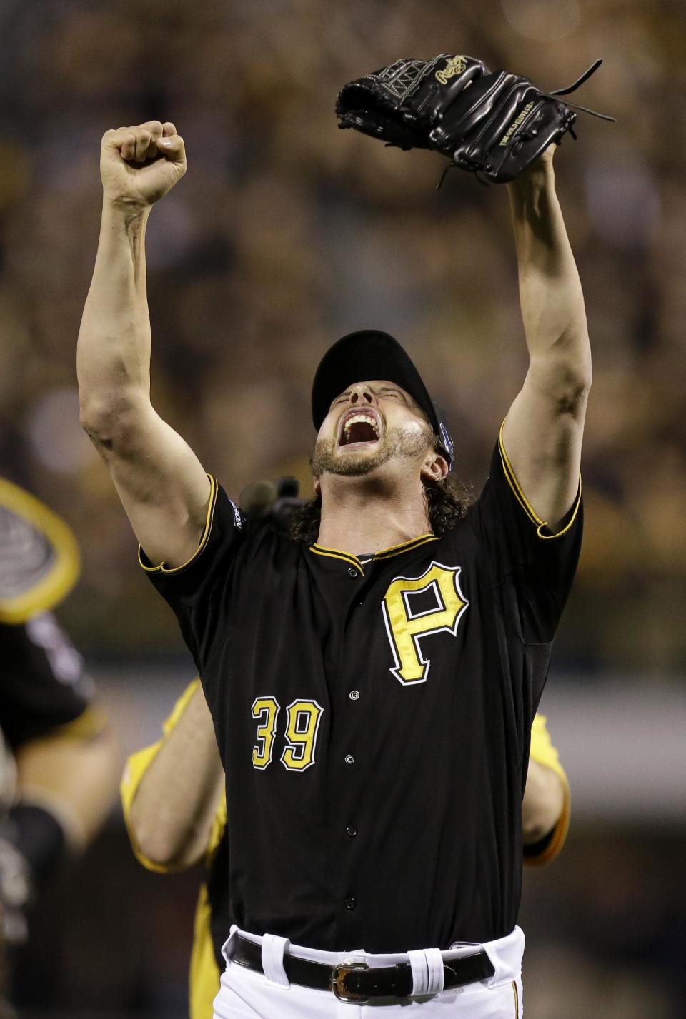 Pittsburgh Pirates relief pitcher Jason Grilli celebrates after getting the last out against the Cincinnati Reds in the NL wild-card playoff baseball game Tuesday, Oct. 1, 2013, in Pittsburgh. The Pirates won 6-2 and advance to the division series. (AP Photo/Gene J. Puskar)