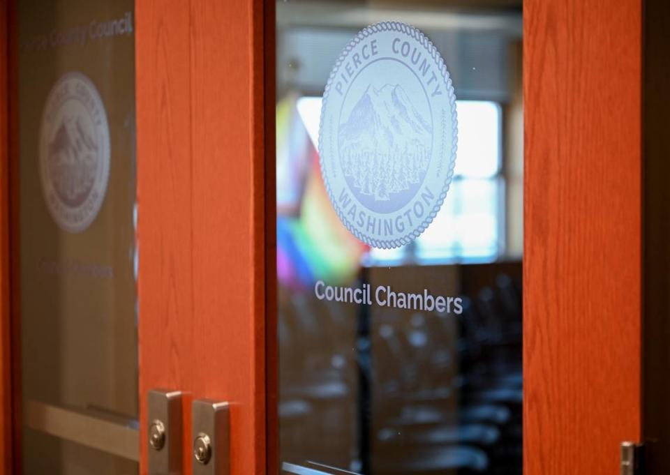 A Pride flag is posted among others inside the Pierce County Council Chambers as seen on Wednesday, July 3, 2024 in Tacoma.