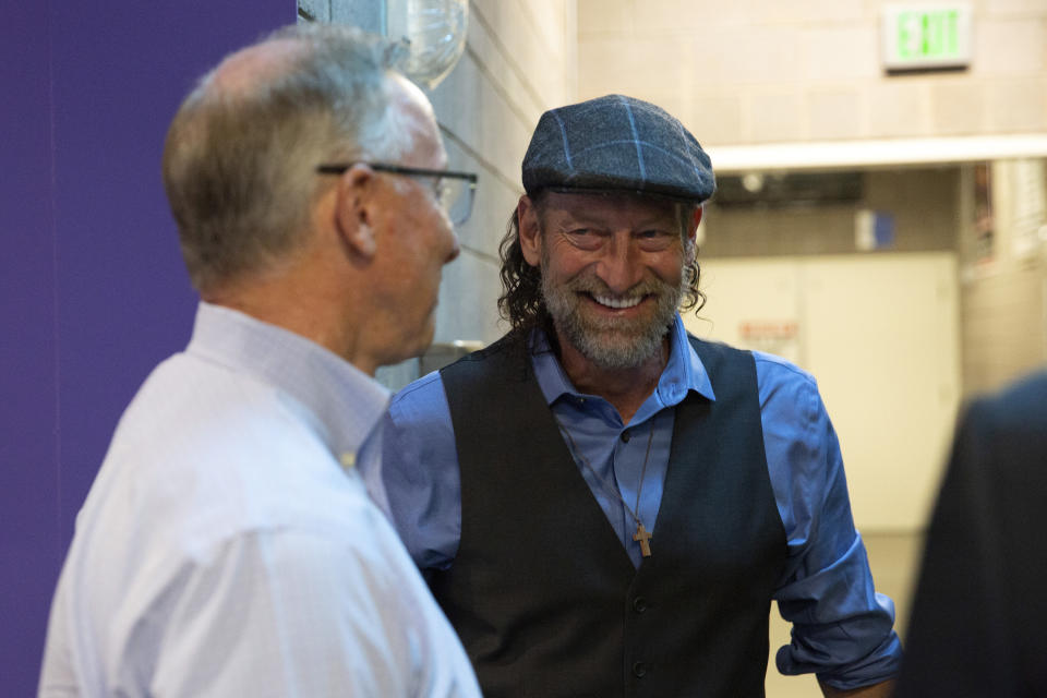 In this image provided by the City of Mesa, actor Troy Kotsur, right, talks with Mesa Mayor John Giles, on Thursday, Aug. 11, 2022 in Mesa, Ariz. Kotsur, who made history as the first deaf man to win an Academy Award, has been honored with a key to his Arizona hometown. (Delia Johnson/City of Mesa via The AP)