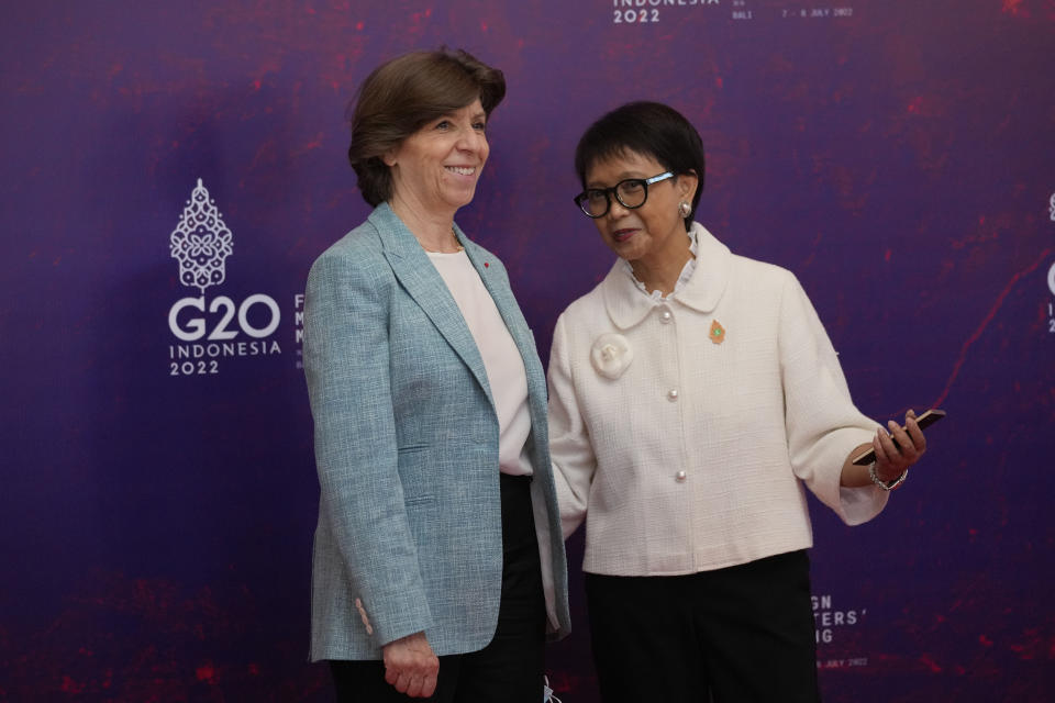 Indonesian Foreign Minister Retno Marsudi, right, greets French Foreign Minister Catherine Collona upon arrival at the G20 Foreign Ministers' Meeting in Nusa Dua, Bali, Indonesia, Friday, July 8, 2022. (AP Photo/Dita Alangkara, Pool)