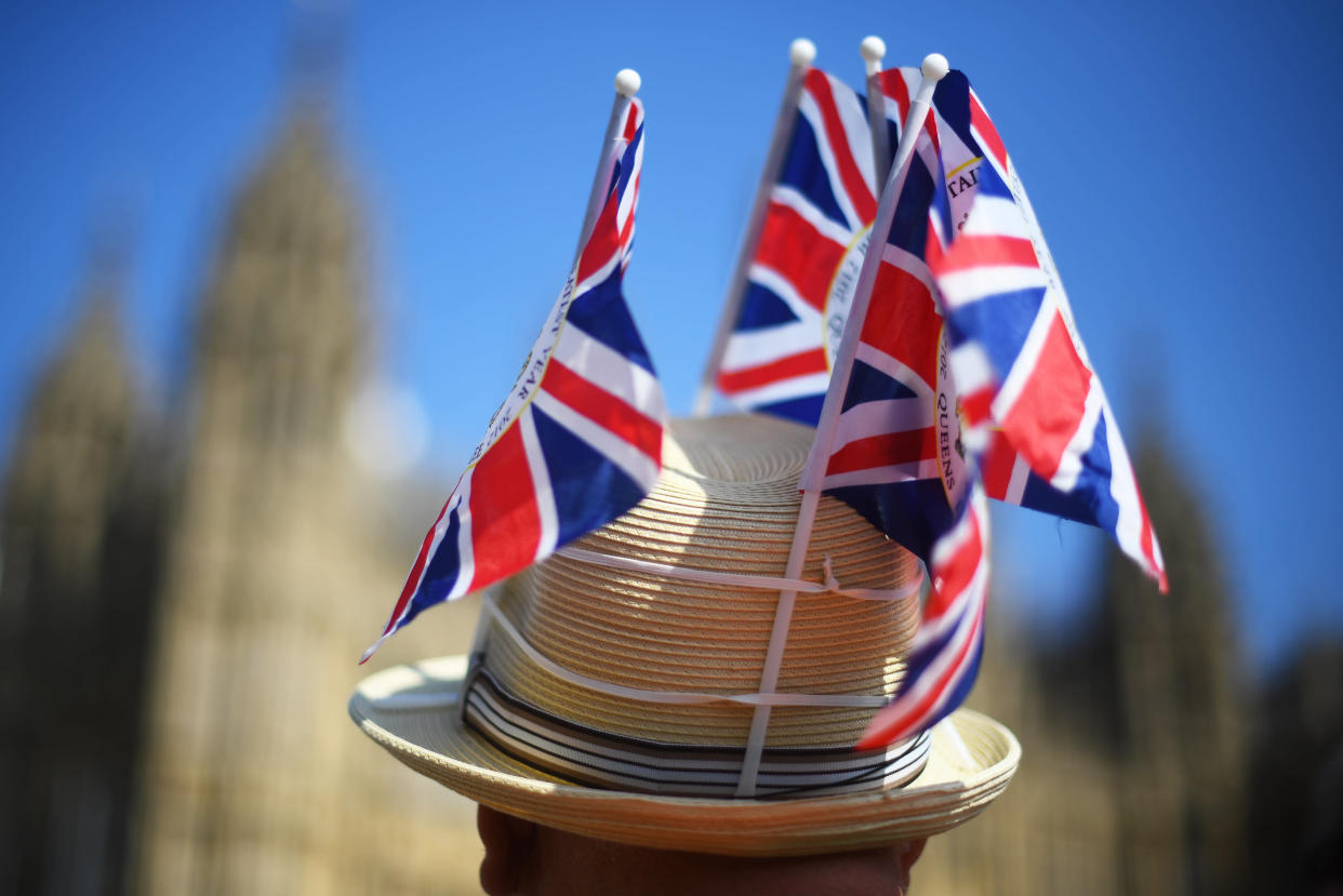 A protester wearing a hat adorned in Union flags outside Westminster (Picture: PA)